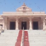 The entrance of Jalaram Temple, showcasing intricate architecture and welcoming steps.