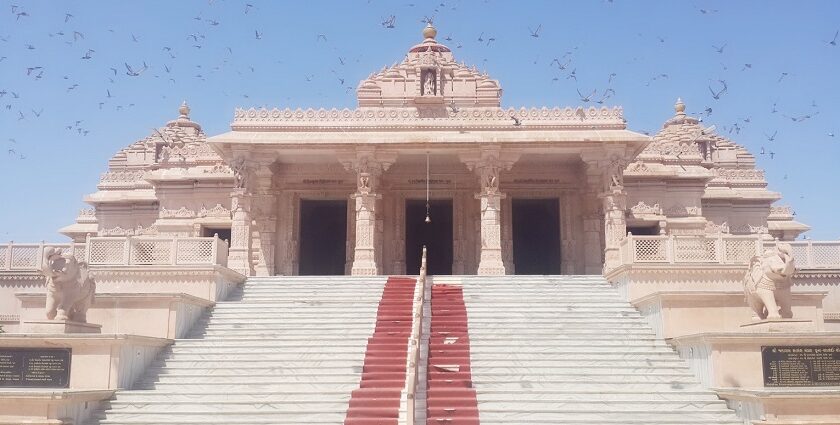 The entrance of Jalaram Temple, showcasing intricate architecture and welcoming steps.