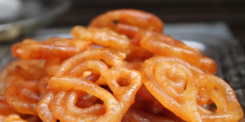Jaleba, a famous Indore cuisine, showcasing the sweet, syrupy dessert with its vibrant colour and texture.