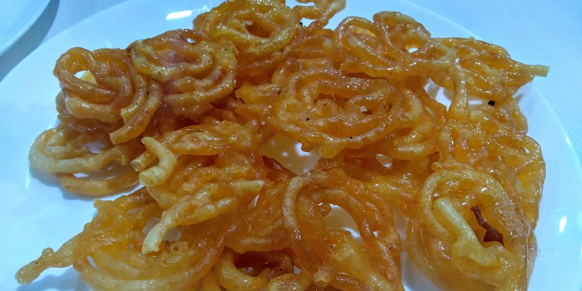 One of the best foods in Kota is crispy jalebi soaked in syrup, a sweet treat with chai.