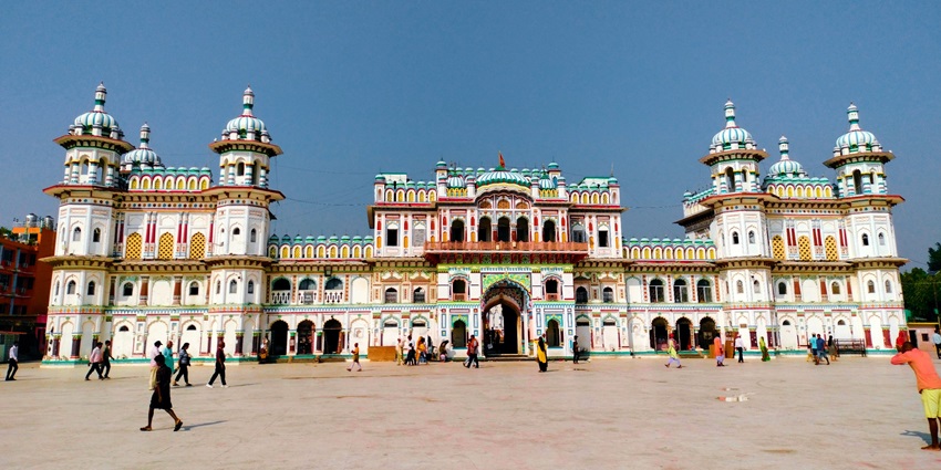 A frontal picture of a Hindu temple donning traditional Hindu architecture in the Janakpur region of Nepal