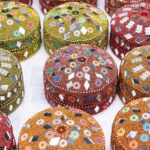 Colourful and traditional Rajasthani small jewellery box decorated with mirror and beads to have during jewellery shopping in Udaipur.