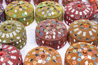 Colourful and traditional Rajasthani small jewellery box decorated with mirror and beads to have during jewellery shopping in Udaipur.