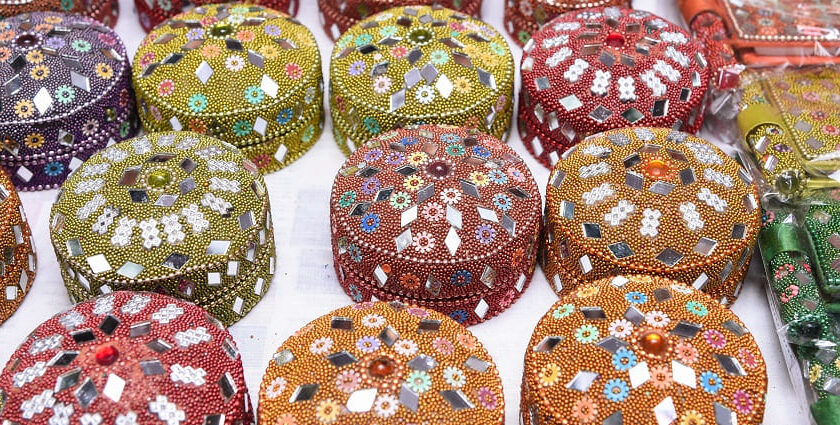 Colourful and traditional Rajasthani small jewellery box decorated with mirror and beads to have during jewellery shopping in Udaipur.