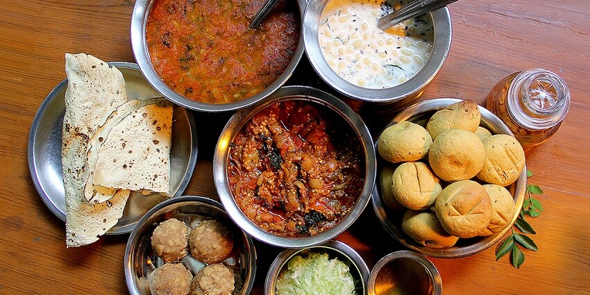 An image of Jodhana Restaurant offers cozy ambiance and traditional Rajasthani thali.