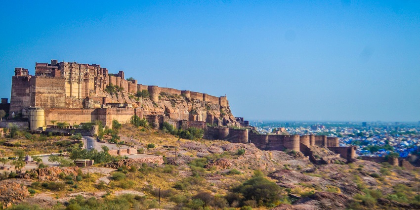 View of Mehrangarh Fort under a clear sky - one of the places to visit in Rajasthan in August.