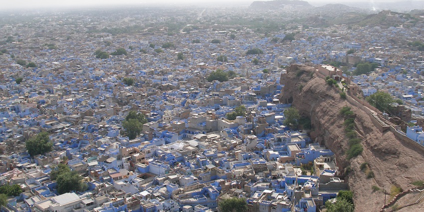 The majestic Mehrangarh Fort overlooking the blue city of Jodhpur, a good place to visit in June in Rajasthan.