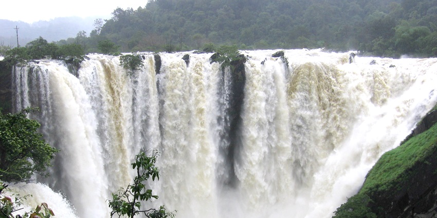 There is a big waterfall cascading over rocky cliffs in a region near the attraction.