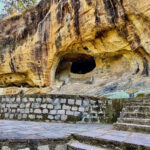 A panoramic view of Jogimara Caves with lush greenery in Chhattisgarh