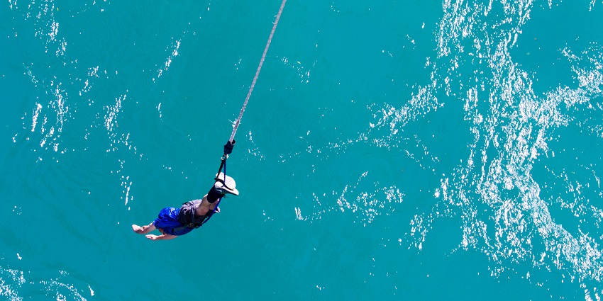 People enjoying adventurous activities in Jump Off Heights with Nalsarovar in view.