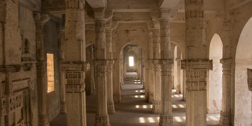 An inside view of the majestic Junagadh tourist attraction made up of red sandstone.