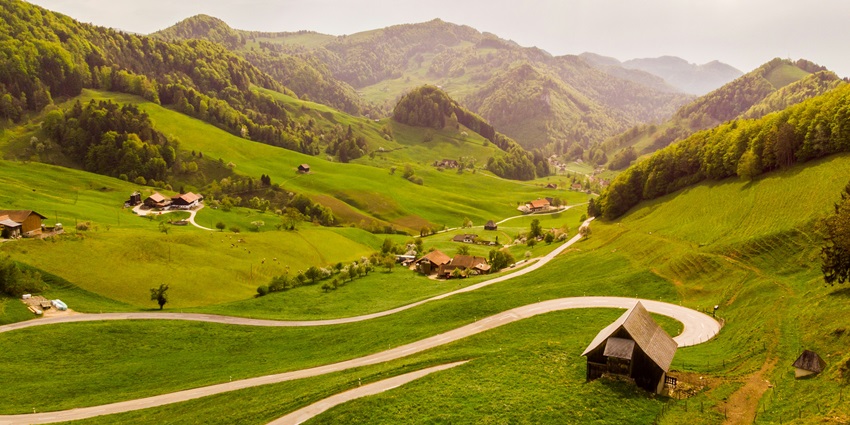 A breathtaking vista of Kadi Village surrounded by lush green meadows in Gujarat.