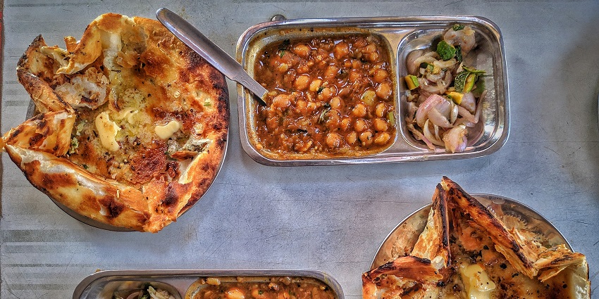 The picture was clicked at a famous food outlet selling Kulcha and Choley