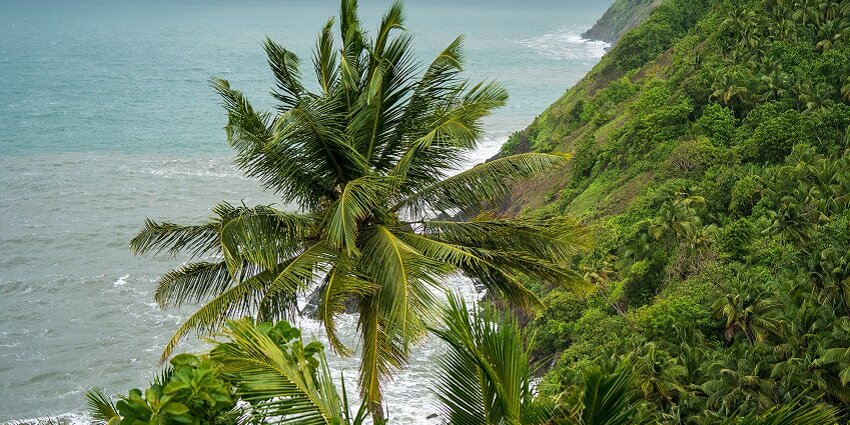 Top view of the lush hills aligning the Kakolem beach