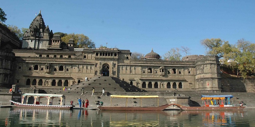 A popular temple in Maheshwar, with intricate carvings and a prominent central dome set against a serene backdrop
