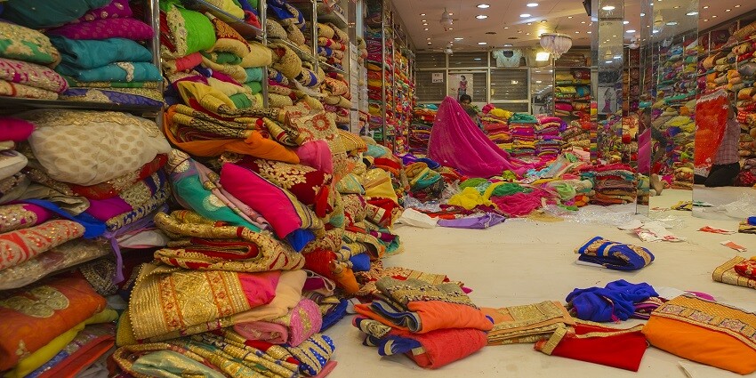 Inspect the fabric, print, and embroidery closely before purchasing a saree.