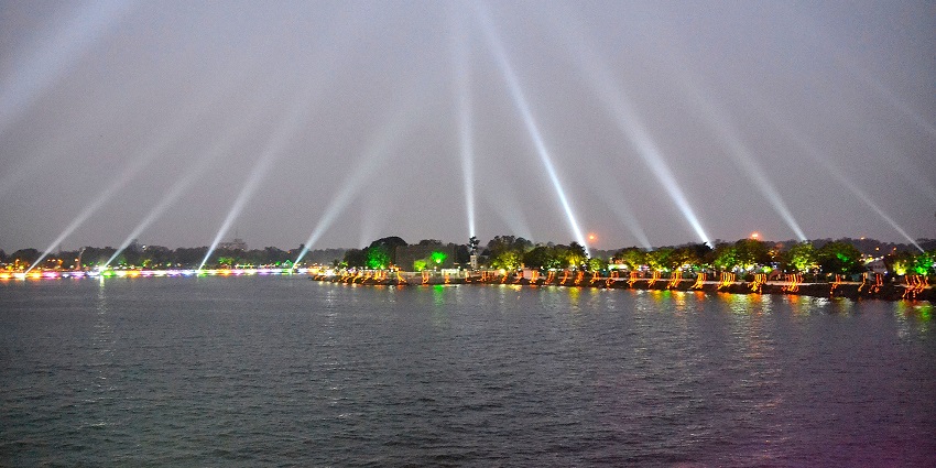 Evening view of Kankaria Carnival in Ahmedabad, featuring colourful lights, and vibrant decorations around Kankaria Lake