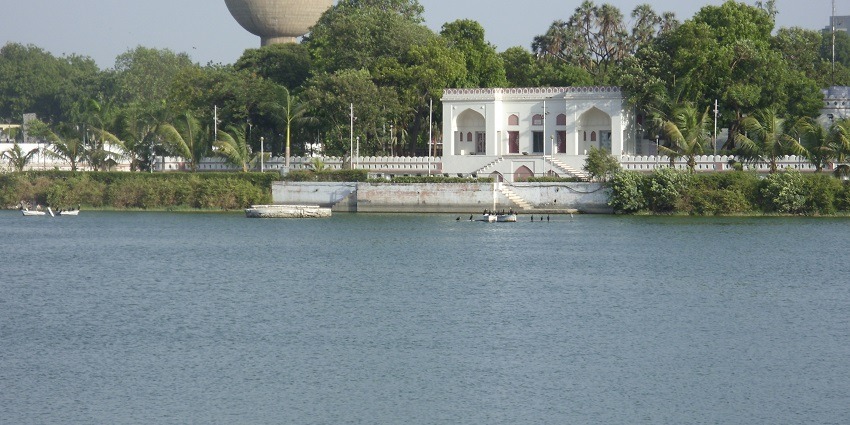 Scenic view of the placid Kankaria Lake surrounded by lush greenery