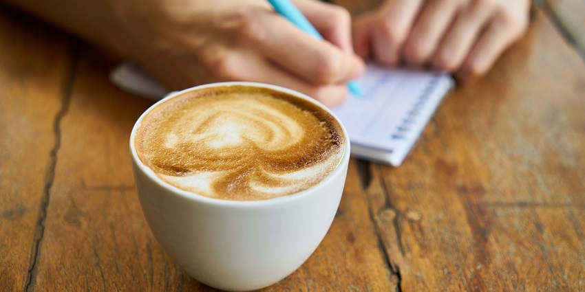 Enjoying a cappuccino at a café in Thimphu, a quiet spot for Thimpu nightlife relaxation.