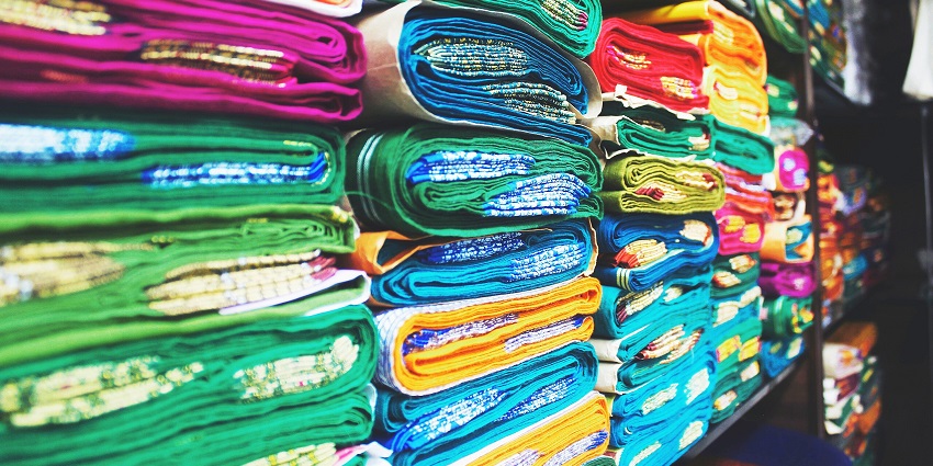 An image of colourful sarees at Karol Bagh which is a place for bridal shopping in Delhi.