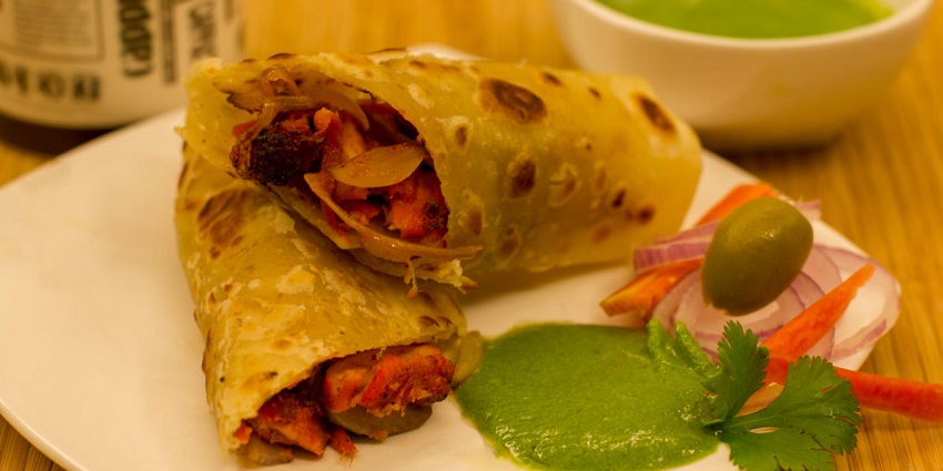Image of chicken kathi rolls served on a plate - one of the best food in Delhi one can try