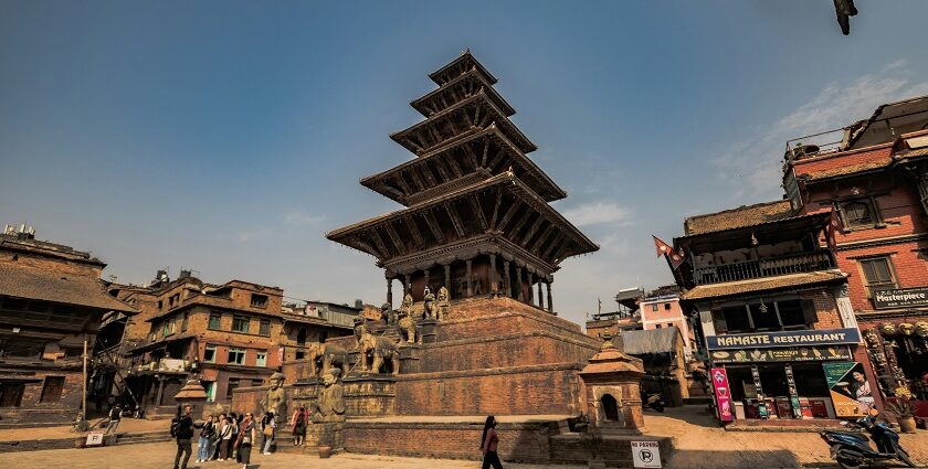 An image of a very tall building sitting in the middle of Kathmandu, the capital city of Nepal.