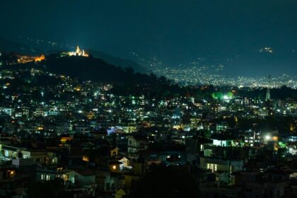 Night street view of Kathmandu with a lot of lit houses, bustling Kathmandu Nightlife.