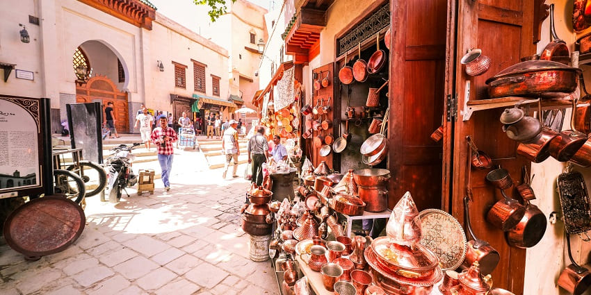 An image of Katra Jaimal Singh Bazaar showcasing vibrant fabrics and handcrafted jewellery.