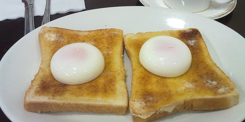 Kaya Toast, a dish with poached eggs on toast - one of the best foods in Singapore.