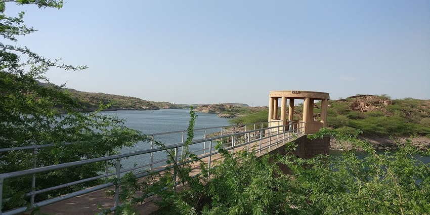 An image of the scenic Kaylana Lake with lush gardens and tranquil waters.