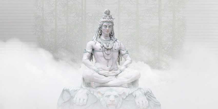 A close-up of a Hindu deity statue, depicting Lord Shiva with detailed carvings and ornate features.