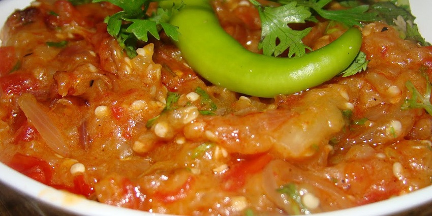 An image of Ker Sangri, a traditional Rajasthani dish with dried berries, beans, spices.
