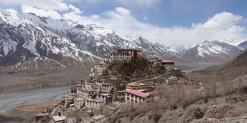 Kee Monastery on a hilltop in Spiti Valley, surrounded by dramatic peaks. It is one of the best places to visit in Spiti Valley in May