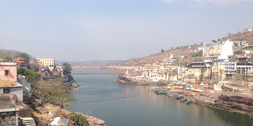 Serene view of the Narmada River flowing through Khalghat, a peaceful destination