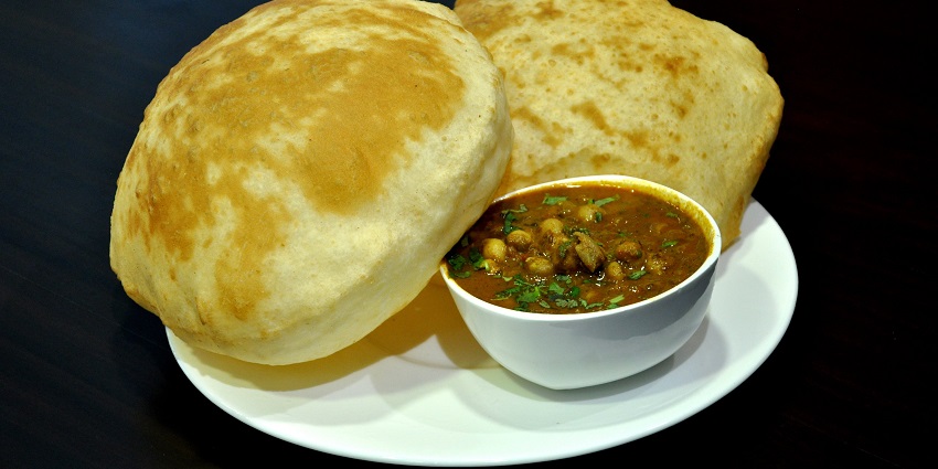 Chole bhature is one of the most popular street food of Delhi served with lassi