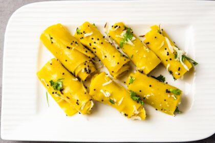 A view of a plate full of Khandvi, the popular street food in Surat which is delicious