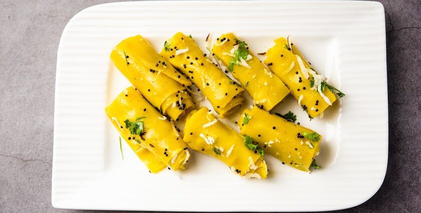 A view of a plate full of Khandvi, the popular street food in Surat which is delicious