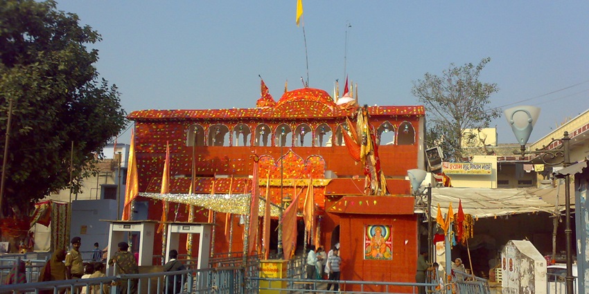 A grand temple with intricate architecture, vibrant decorations, and a spiritual aura.