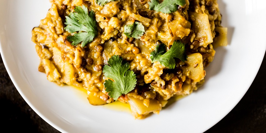 A plate of khichdi, the traditional dish made with simplicity, garnished with coriander
