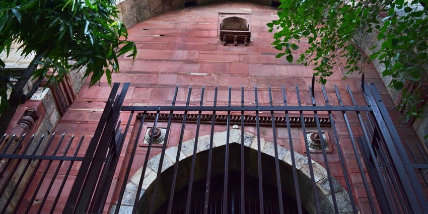 A historic stone gateway standing tall on Bahadur Shah Zafar Marg, steeped in tales of bloodshed and mystery.
