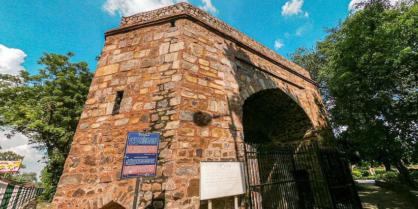 A wide view of Khooni Darwaza, showcasing its historic architecture and surrounding area.