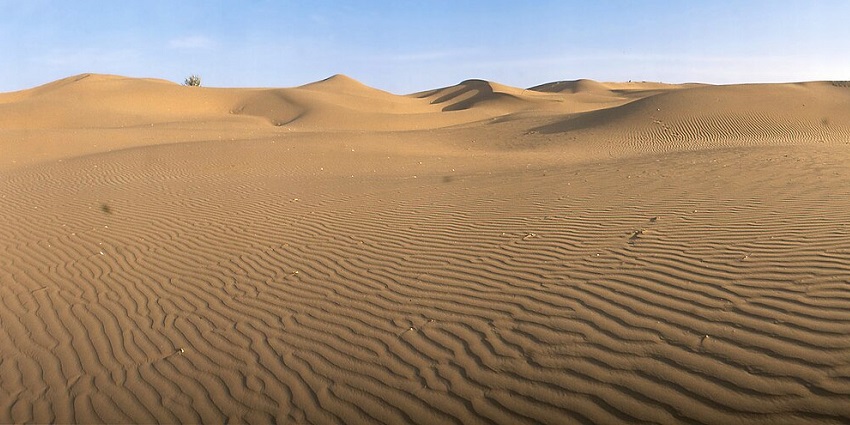 Panoramic view of Juri, showcasing a wide landscape with rolling hills and a clear sky