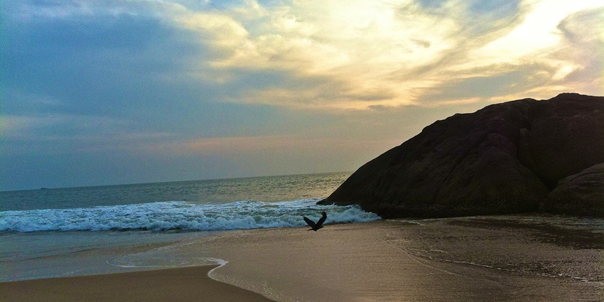 The best beach in Karnataka with clear waters creates the perfect setting for a sunset
