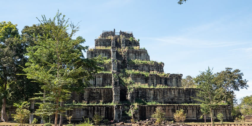 Ancient stone temple ruins surrounded by dense forest at Koh Ker, Cambodia