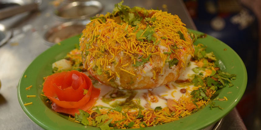 An image of Kota Kachori which is one of the best foods in Kota served with chutney.