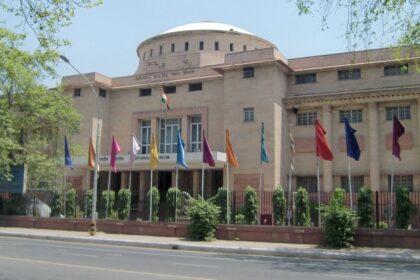 View of one of the Kota museums, surrounded by trees and colourful flags