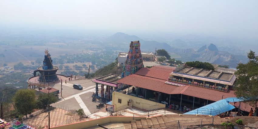 An aerial view of a temple with a colourful Gopurama and Shivalinga at the entrance