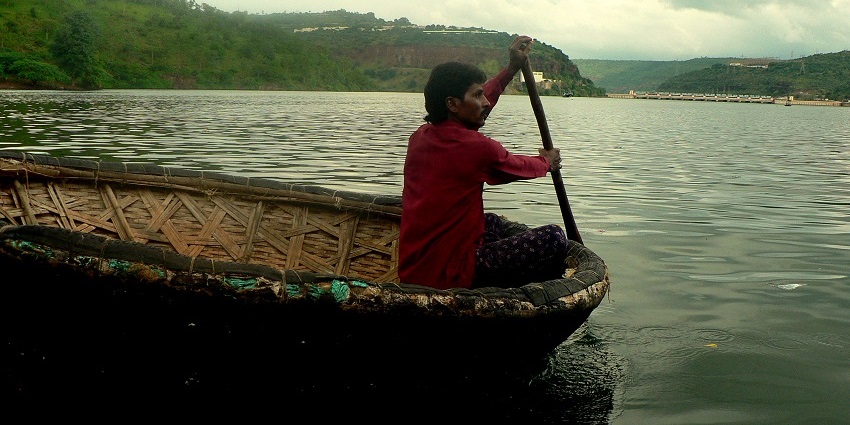 Traditional round boats, known as Putti Teppalu, floating on the Krishna river at Srisailam, Andhra Pradesh.