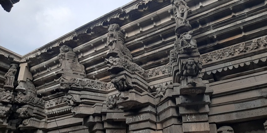 Kudal Sangam Temple with intricate carvings and tall pillars in Solapur, Maharashtra.