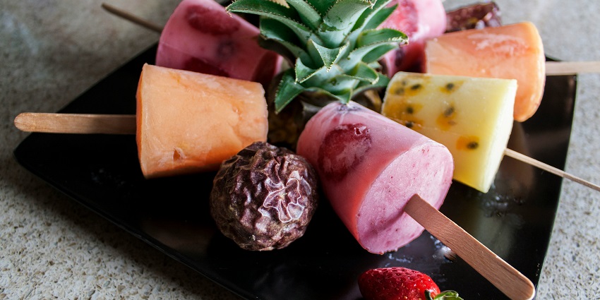 A glimpse of colorful Kulfi served on a plate, one of the best foods in Surat, Gujarat.